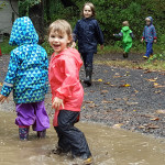 Children playing in the rain and the mud