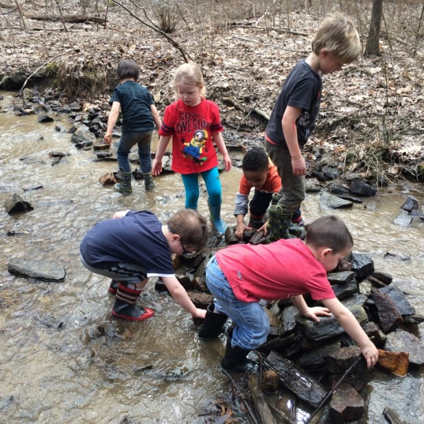 Children playing in a stream